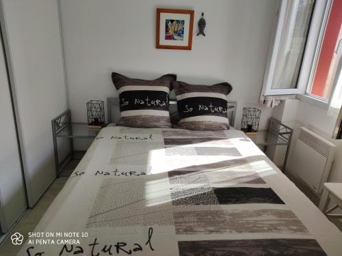 Postel nebo postele na pokoji v ubytování Soulac Côté Plage vue ocean