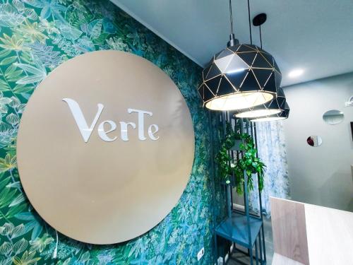 a large round sign on the wall of a room at VerTe in Techirghiol