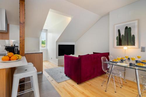 a kitchen and living room with a table and chairs at Lisbon Prime Aparts - BeatoHub in Lisbon