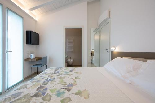 Postel nebo postele na pokoji v ubytování ARIA Design B&B Levanto