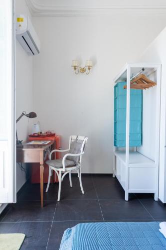 a room with a desk and a chair and a table at Bed and Breakfast Terra del Sole Ibla in Ragusa