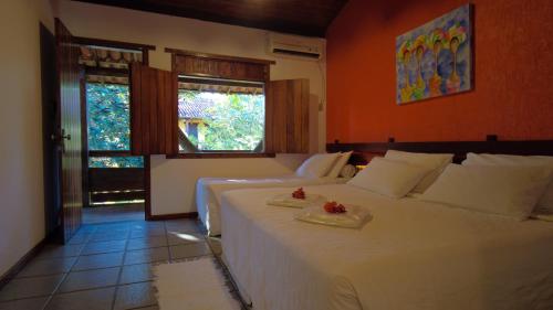 Postel nebo postele na pokoji v ubytování Hotel Pousada Marambaia