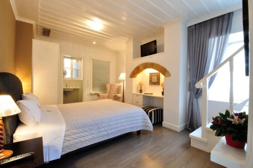 Postel nebo postele na pokoji v ubytování il Palazzo Rooms & Suites