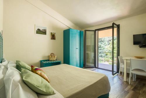 Postel nebo postele na pokoji v ubytování Ulivo Blu Holiday Homes