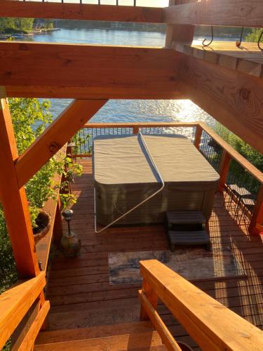 an overhead view of a deck with a bed at THE INN Bigfork Bay in Bigfork