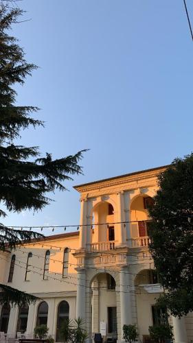 a large building with a balcony on top of it at Guest House Villa Angaran San Giuseppe in Bassano del Grappa