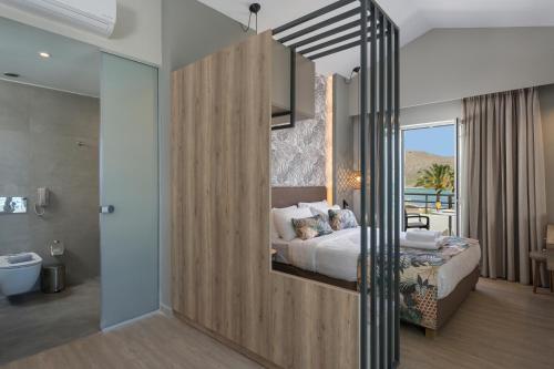 Ein Bett oder Betten in einem Zimmer der Unterkunft Mare Blue Suites