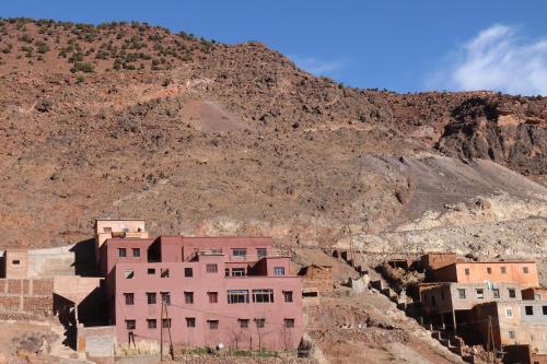 a group of buildings in front of a mountain at Auberge Matat in Imlil