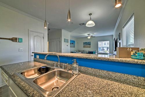 a kitchen with a sink and a counter top at Modern Island Condo with Pool Steps to the Beach! in South Padre Island