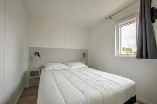 Ένα ή περισσότερα κρεβάτια σε δωμάτιο στο Chalet pour 6, résidence de vacances avec piscine