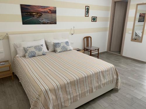 Posteľ alebo postele v izbe v ubytovaní Monolocale “Andromeda” a due passi dalla Guitgia