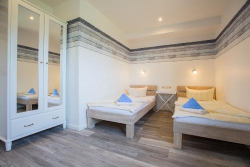 Postel nebo postele na pokoji v ubytování Appartements Hafen 31