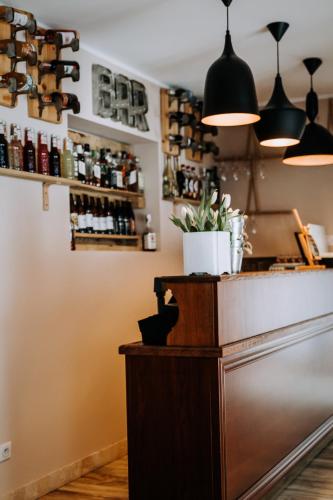 a bar with wine bottles on the wall at Willa Sepia SPA in Wisła