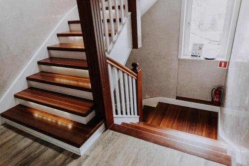 a stairway with wooden floors and a stair case at Willa Sepia SPA in Wisła