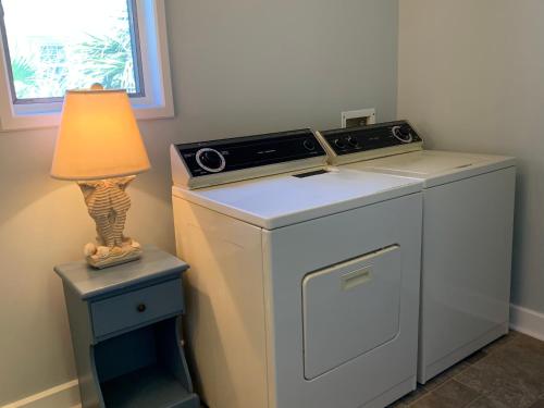 a washing machine with a lamp on top of it at Beach Bum Paradise Edisto Beach with Pool in Edisto Island