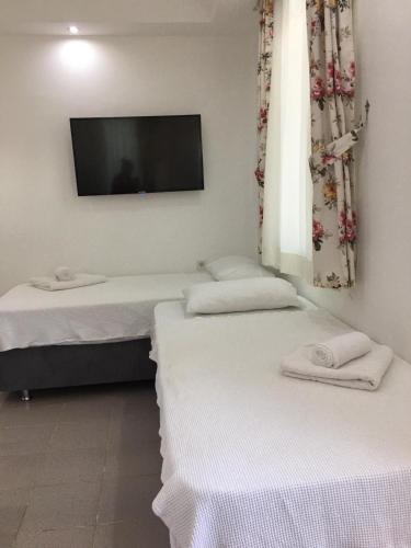 Ένα ή περισσότερα κρεβάτια σε δωμάτιο στο Sunset Apart Otel