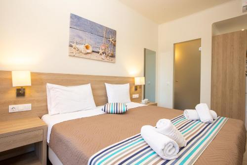 Postel nebo postele na pokoji v ubytování Passas Mare Apartments & Studios