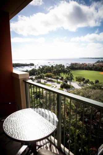 a balcony with a table and a view of the ocean at The Mutiny Luxury Suites Hotel in Miami