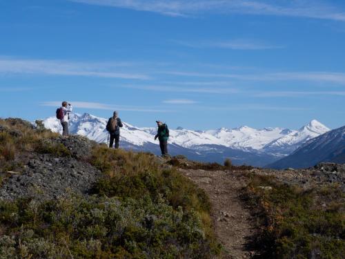 a group of people standing on top of a mountain at The Singular Patagonia Hotel in Puerto Natales