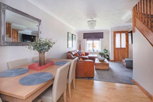 a dining room with a table and a mirror at Victoria Retreat in York