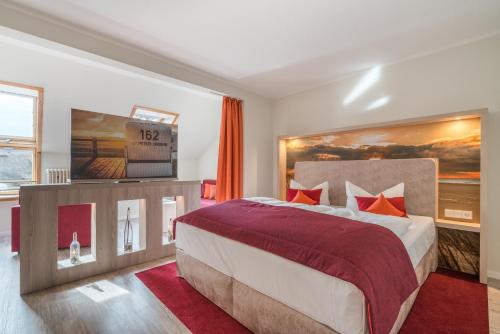 Ein Bett oder Betten in einem Zimmer der Unterkunft Hotel Garni Kölfhamm