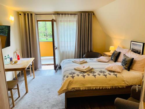 Postel nebo postele na pokoji v ubytování Apartamenty u Magika