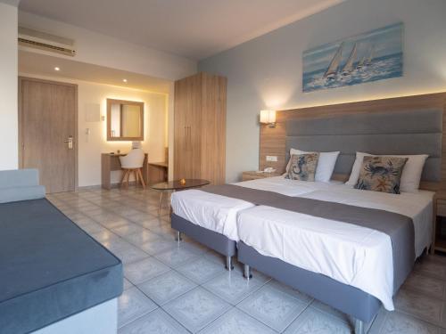 Posteľ alebo postele v izbe v ubytovaní Aristo Apts