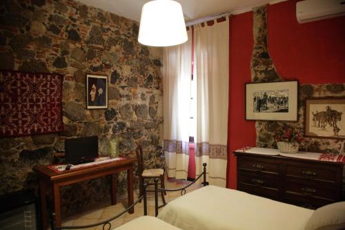 Кровать или кровати в номере Agriturismo Il Giglio