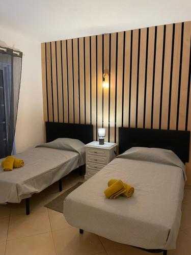 Ένα ή περισσότερα κρεβάτια σε δωμάτιο στο Travellers Guesthouse