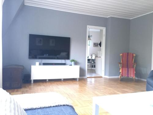 a living room filled with furniture and a tv at Nebulosavägen 20 in Sundsbruk
