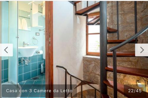 a bathroom with a staircase and a sink at Stella Marina in Stari Grad