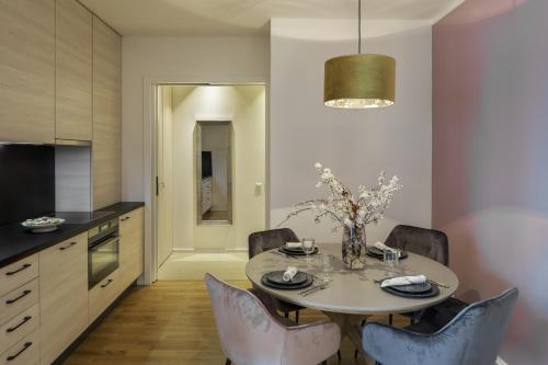 a dining room with a table and chairs at Sophisticated Condo in Nusle by Prague Days in Prague