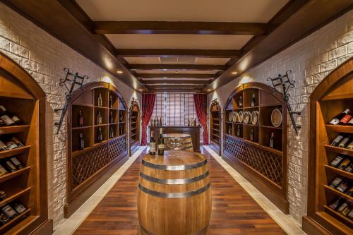a wine cellar with a large wooden barrel tasting room at Shamakhi Palace Sharadil in Şǝrǝdil