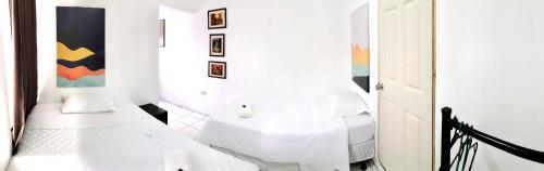 Ένα ή περισσότερα κρεβάτια σε δωμάτιο στο Casa Mama Fanti