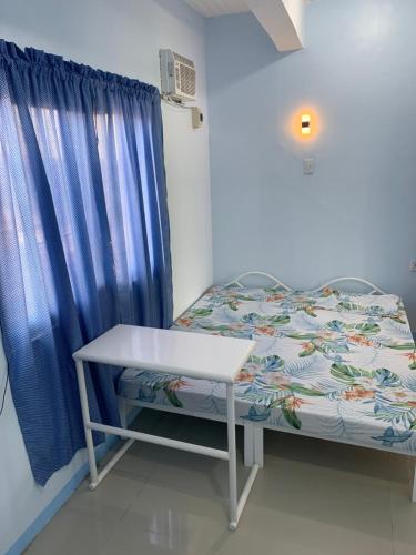 Кровать или кровати в номере RGC Residences