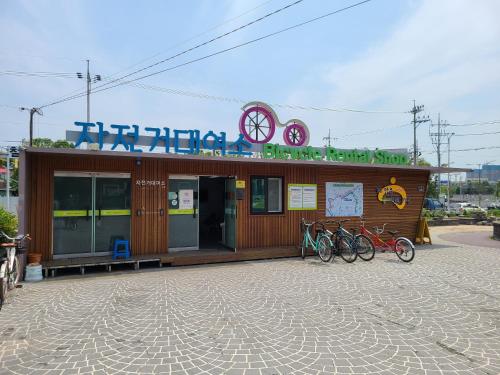a building with bikes parked in front of it at Chenal Motel in Daegu