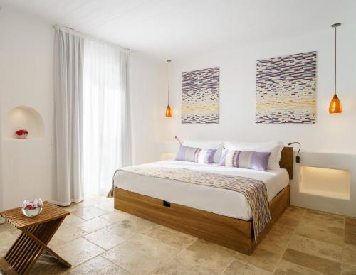 a bedroom with a large bed in a room at Sant Efis Hotel in Pula