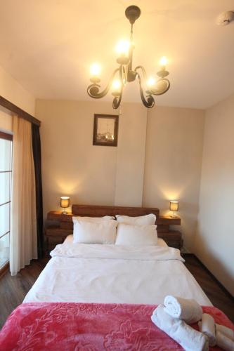 Una cama o camas en una habitación de Hotel Happy