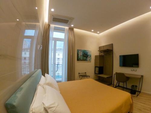 TV a/nebo společenská místnost v ubytování Municipio Luxury Suite