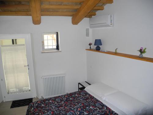 Posteľ alebo postele v izbe v ubytovaní Casa la Piazzetta Rinascimentale