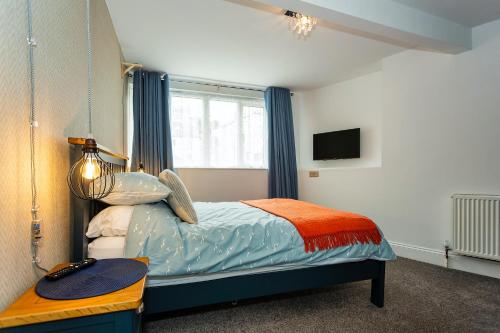 Ένα ή περισσότερα κρεβάτια σε δωμάτιο στο Seagulls Loft, Grove Apartments
