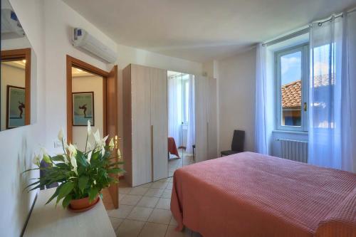 Posteľ alebo postele v izbe v ubytovaní Casa Lido Lake View