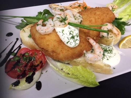 a plate of food with shrimp and vegetables on it at Pension Haus Fürstenberg in Grünhain-Beierfeld