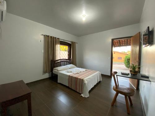 En eller flere senge i et værelse på Pousada do Lajes