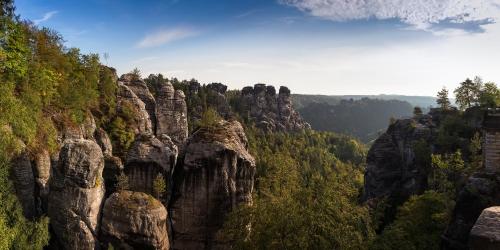 a view of a mountain with trees and rocks at Haus am Wald in Bad Schandau