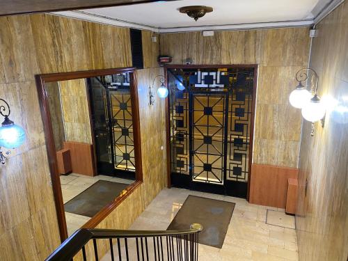 an empty room with a door and a chair in front at Hostal Granvia 628 in Barcelona