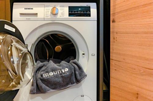 a washing machine with a towel inside of it at moun10 urlaubswohnen in Garmisch-Partenkirchen