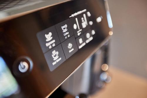a close up of a control panel of a microwave at moun10 urlaubswohnen in Garmisch-Partenkirchen
