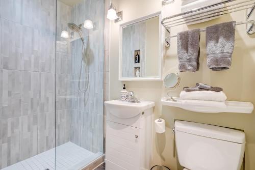 a bathroom with a shower and a toilet and a sink at Amante Luxury Bed & Breakfast in Victoria