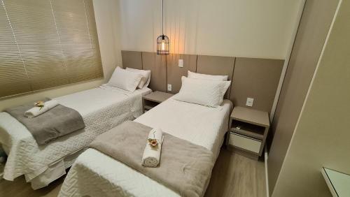 מיטה או מיטות בחדר ב-Novíssima e linda casa com PISCINA na região central de Foz